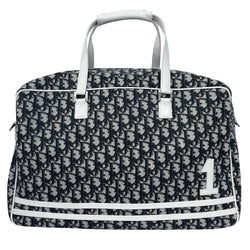 Christian Dior black monogram canvas large travel tote by John Galliano for Dior, 2001 runway. White patent leather flat handles, piping, accent No 1 with 2 accent stripes in front. Small back ID slotted window. Silver-tone zipper and hardware opens to black satin fabric lining with one zip pocket and snap closure slip pockets. Made in Italy 