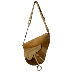 Christian Dior brown, tan, cream pony and suede saddle bag by John Galliano for Dior, 2002. Embossed leather and pony flap with suede front accent, body and shoulder strap, antique brass-tone logo engraved hardware, rear slip pocket, interior jacquard logo lining, zip pocket. 