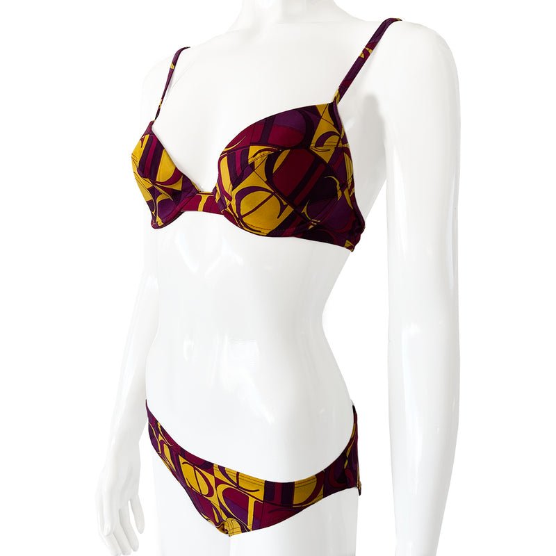 Christian Dior Purple and Yellow CD Logo Bikini with mid rise bottoms and all over modern CD logo print in purple and yellow. Molded bra cups with underwire Gold CD logo clasp closure in back, non-adjustable stretch straps.  Made in France 