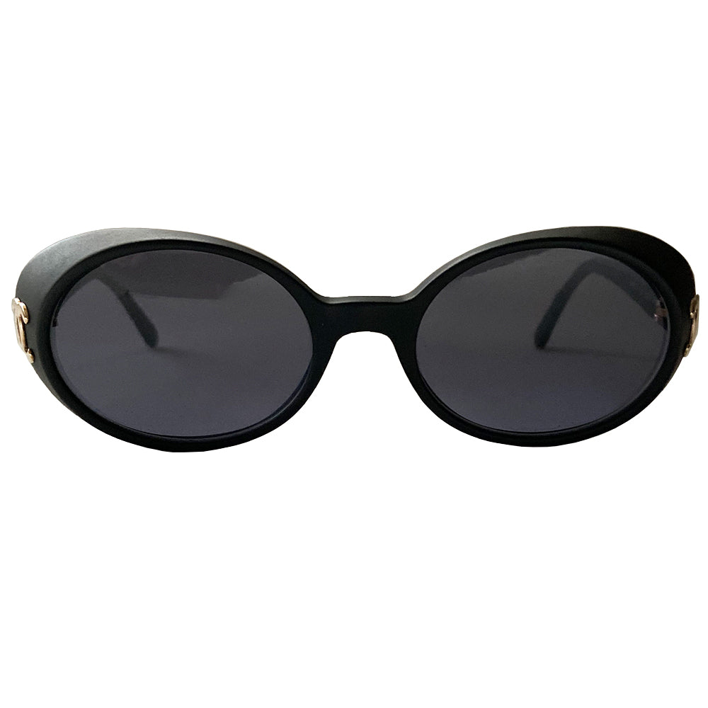Chanel 1990’s oval goggle sunglasses by Karl Lagerfeld for Chanel. Oval goggle style acetate frames with dark charcoal lenses, interlocking CC gold logos at temple Frame Color: Flat black Style: 05976 Case included Condition: Excellent with no scratches on lens or frame, case in good condition Made in Italy