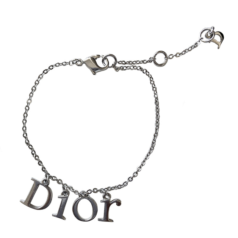 Christian Dior silver-tone charm bracelet with hanging letters that spell DIOR. Lobster back closure with 2 length adjustment loops and small hanging logo D charm.  Box included. 