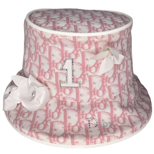 Unused Christian Dior pink monogram Girly collection bucket hat by John Galliano for Dior, spring 2004 adorned with flowers, pearls, Swarovski crystal Dior logo on brim and surrounding leather No 1 in front, patent leather piping. Made in France
