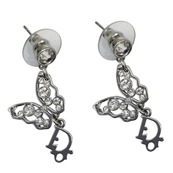 Christian Dior crystal butterfly earrings circa 2005 White crystals set in silver-tone metal clutch back closure earrings Crystal post attached to dangling crystal embellished butterfly with silver-tone Dior logo dangling below 