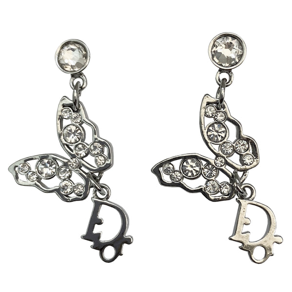 Christian Dior crystal butterfly earrings circa 2005 White crystals set in silver-tone metal clutch back closure earrings Crystal post attached to dangling crystal embellished butterfly with silver-tone Dior logo dangling below 