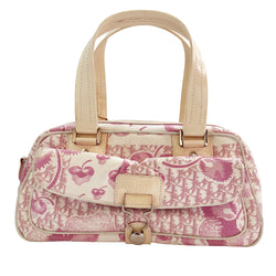 Christian Dior cherry blossom boston bag by John Galliano for Dior from 2004 Logo Flowers Collection. Pink flowers and monogram print canvas with patent calfskin handles and accent, silver hardware and zipper. Outside front pocket with Dior logo  and front metal loop clasp. Pink with cream patent accent, pink textile interior with single zip pocket. 