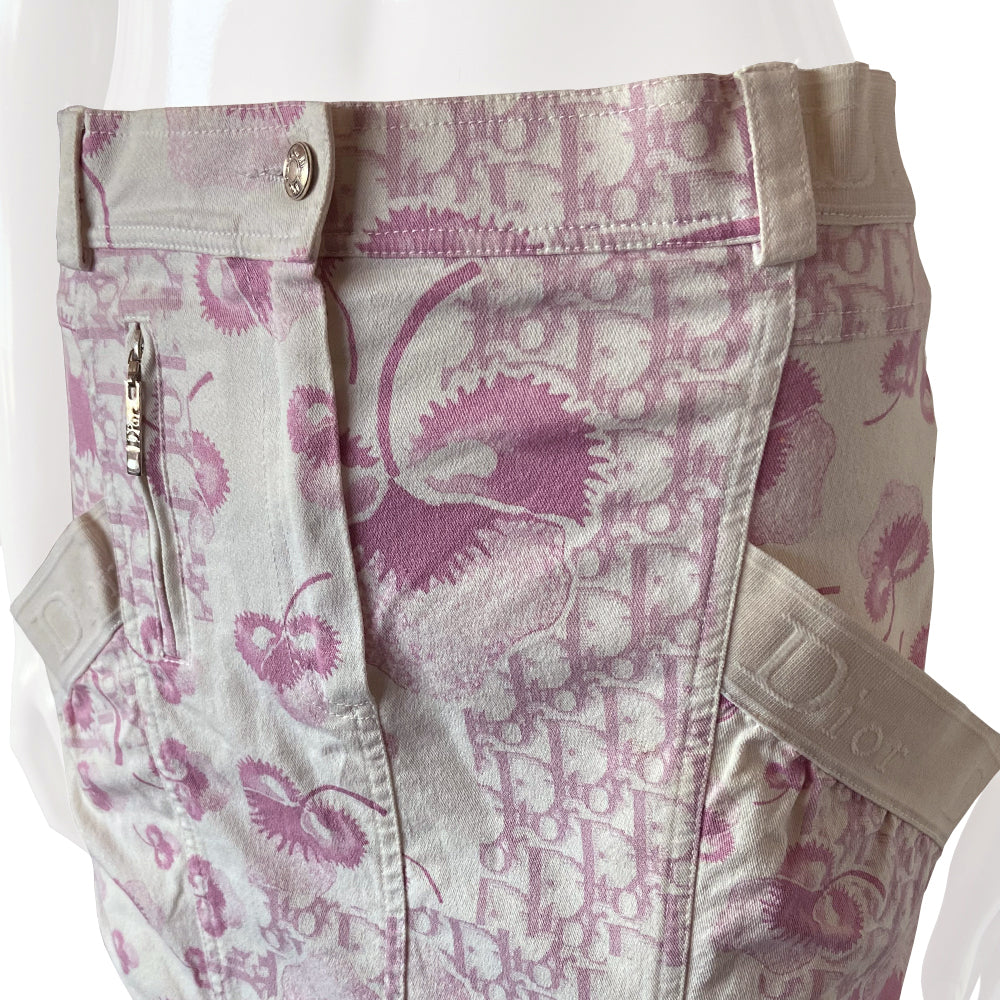 Christian Dior pink cherry blossom skirt by John Galliano for Dior circa 2004 from Logo Flowers Collection. Panelled skirt with belt loops, Dior logo elastic details. Front zipper closure with silver-tone logo button closure and embellished with front logo silver-tone zipper detail, 2 large side wrap around patch pockets. 