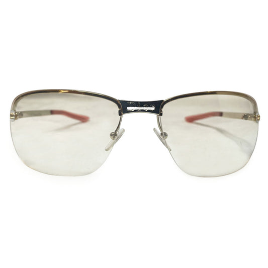 Christian Dior Adiorable 5 clear frameless sunglasses with Curved lens metal frame across upper lens and frameless on the bottom. Gold-tone metal frame with clear blush tinted lenses, Dior engraved logo at nose bridge, star screws at lens outer edges. Style: 3YJIG. Made in Italy 