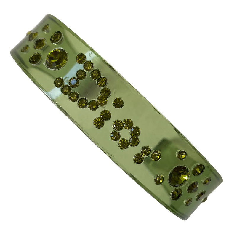 Christian Dior narrow green lucite crystal cuff with Dior spelled out in embedded brilliant green crystals. 