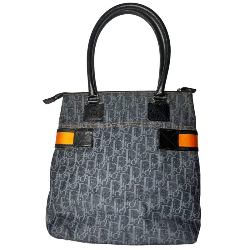 John Galliano for Dior, 2004 navy Diorissimo denim with orange contrast stitching, orange band, silver CD stamped D clasp hardware. Top zip with one interior pocket and navy nylon lining. Made in Italy
