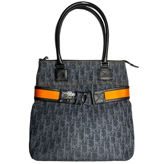 John Galliano for Dior, 2004 navy Diorissimo denim with orange contrast stitching, orange band, silver CD stamped D clasp hardware. Top zip with one interior pocket and navy nylon lining. Made in Italy
