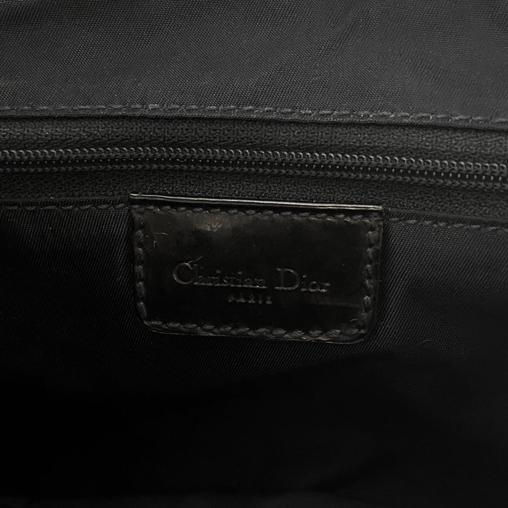 Christian Dior I Heart Sex denim saddle bag by John Galliano for Dior 2001. Trompe l’oeil blue and black denim with patch printed designs, black leather shoulder strap with silver-tone CD logo attachments, leather piping and hanging straps, silver-tone CD hanging logos. front flap, rear single slip pocket, interior zip pocket. Made in Italy 