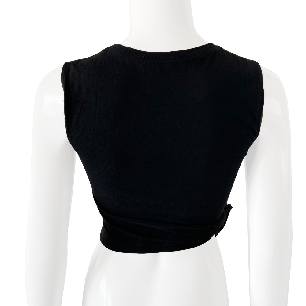 Chanel white ribbed perforated knit top by Karl Lagerfeld for Chanel, Spring 1997. Crew neck, all white short sleeved tee with perforations at ribbing edges and small woven diamond patterns to form horizontal stripes and 4 alternating rows of tiny perforations that form the word CHANEL. Made in France.