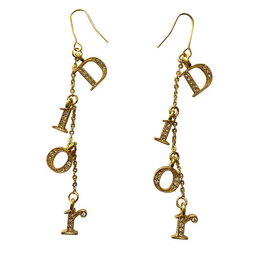 Christian Dior hook style gold-tone chain drop earrings featuring white crystal embellished Dior logo letters and single chain with Dior logo engraved stamp in back. 