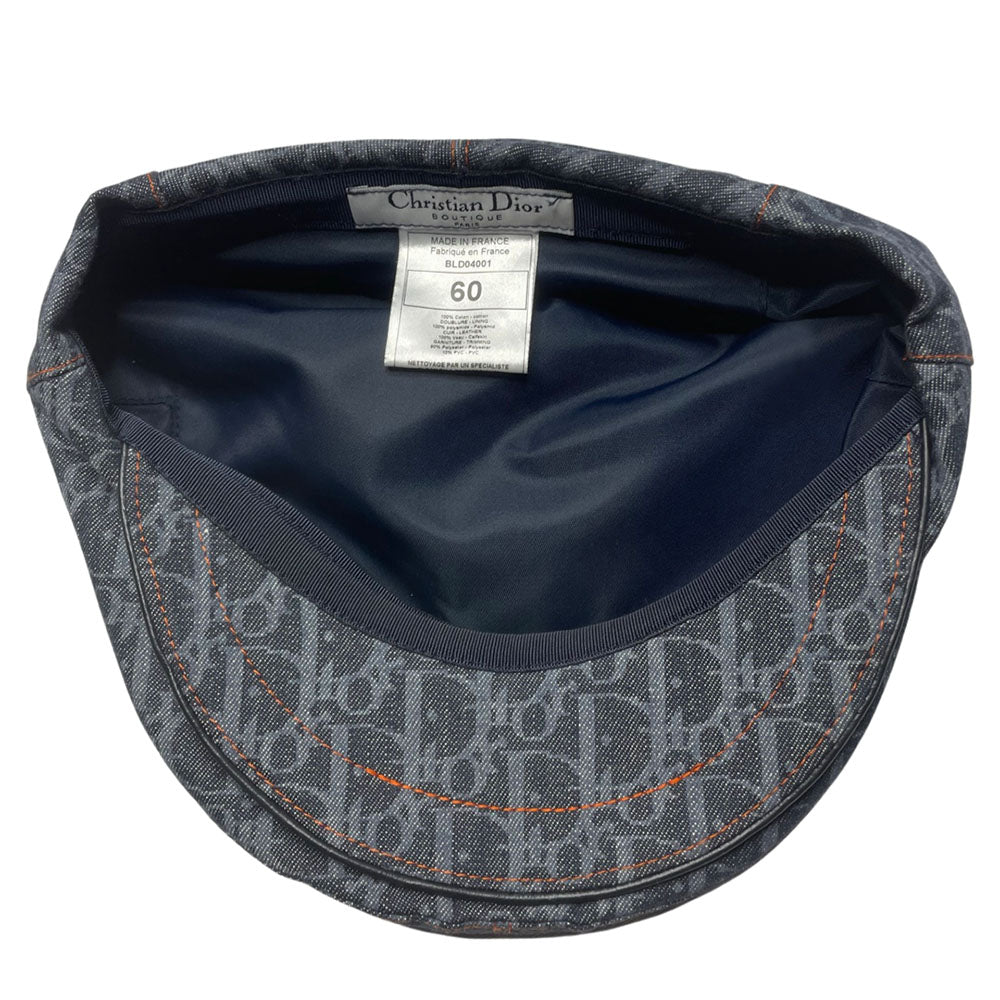 John Galliano for Dior, 2004 navy monogram denim cap with orange contrast stitching, orange band, calf leather accent trim, orange rubber Dior logo hanging tag attached. Grosgrain interior ribbon, lined in navy nylon. Made in France