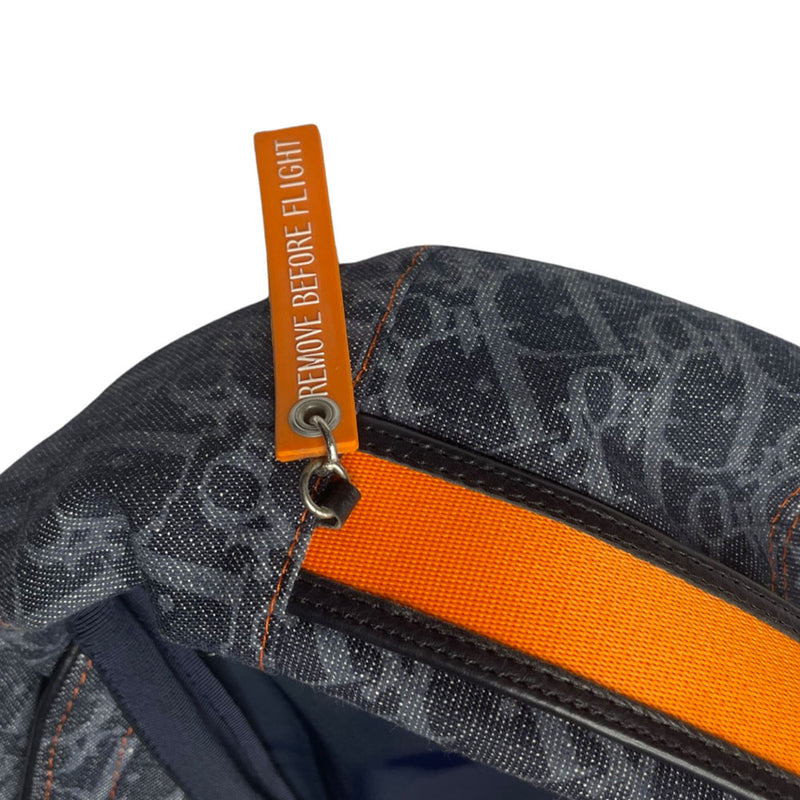 John Galliano for Dior, 2004 navy monogram denim cap with orange contrast stitching, orange band, calf leather accent trim, orange rubber Dior logo hanging tag attached. Grosgrain interior ribbon, lined in navy nylon. Made in France