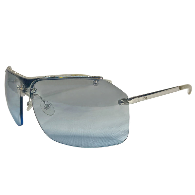 Christian Dior HIT 2 frameless sunglasses with curved blue tint lens, logo engraved silver-tone metal bridge and arms, crystal embellished upper frame, Made in Italy 