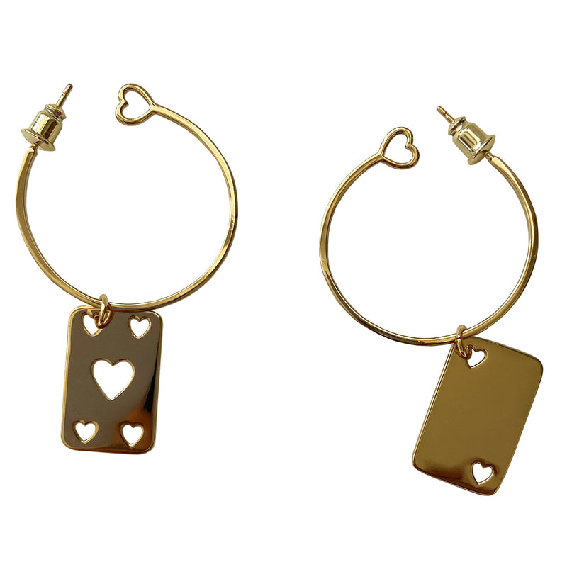 Christian Dior Earrings gold-tone metal hoop earrings with open heart design at one end, dangling heart cutout feature and etched Dior logo on playing cards. Clutch back closure. Missing the single hanging D charm 