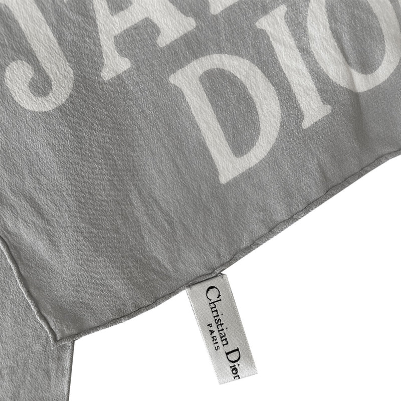 Christian Dior J’Adore Dior long rectangular silk pale grey scarf with white logo printed at each end and hand rolled edges. Made in Italy 