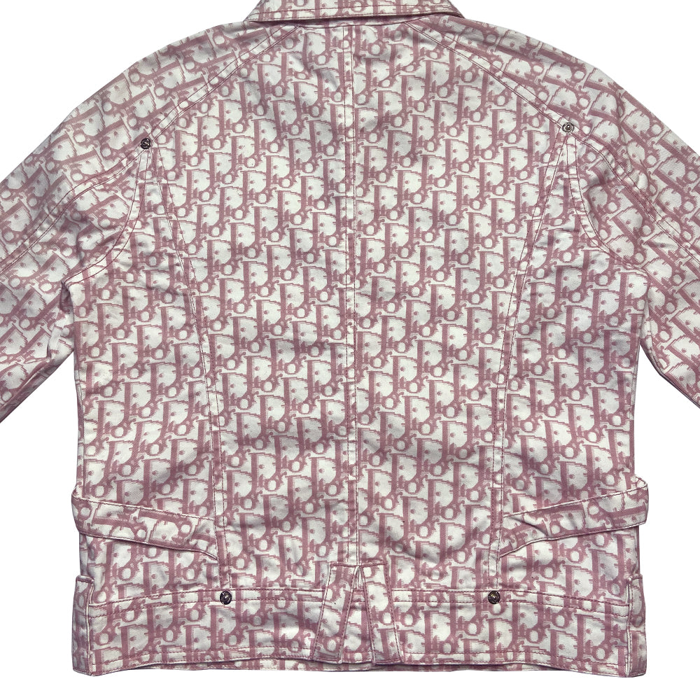 Christian Dior pink monogram Girly button up denim jacket by John Galliano for Dior, spring 2004 with 2 front flap pockets at chest and No 1 surrounded by Swarovski crystals. Silver-tone logo buttons and engraved logo buckle details on adjustable side straps, Dior crystal logo at one sleeve cuff. Made in Portugal 
