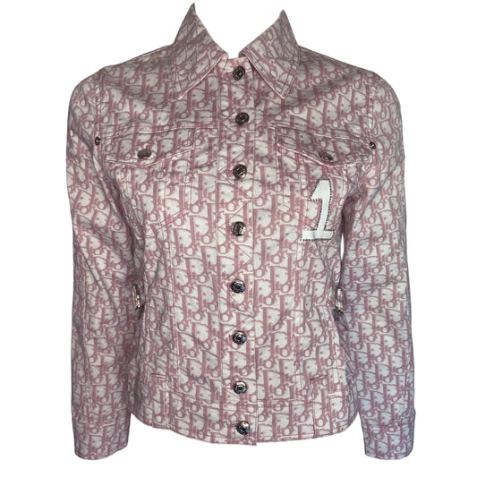 Christian Dior pink monogram Girly button up denim jacket by John Galliano for Dior, spring 2004 with 2 front flap pockets at chest and No 1 surrounded by Swarovski crystals. Silver-tone logo buttons and engraved logo buckle details on adjustable side straps, Dior crystal logo at one sleeve cuff. Made in Portugal 