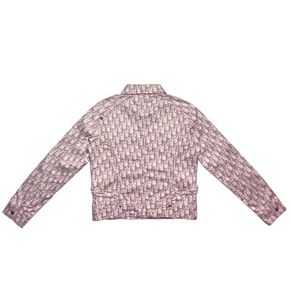 Christian Dior pink monogram Girly button up denim jacket by John Galliano for Dior, spring 2004 with 2 front flap pockets at chest and No 1 surrounded by Swarovski crystals. Silver-tone logo buttons and engraved logo buckle details on adjustable side straps, Dior crystal logo at one sleeve cuff. Made in Portugal 