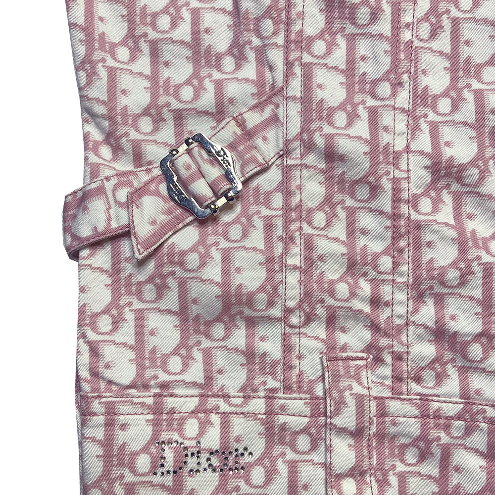 Christian Dior pink monogram Girly button up denim jacket by John Galliano for Dior, spring 2004 with 2 front flap pockets at chest and No 1 surrounded by Swarovski crystals. Silver-tone logo buttons and engraved logo buckle details on adjustable side straps, Dior crystal logo at one sleeve cuff. Made in Portugal 