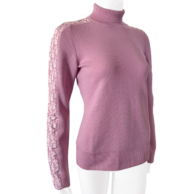 Christian Dior turtleneck pink wool sweater from John Galliano for Christian Dior, winter 2004 with ribbed turtleneck and cuffs, pink Diorissimo accent stripe on sleeves from cuff to neck. Size 38.  Made in Italy 