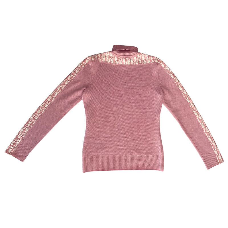 Christian Dior turtleneck pink wool sweater from John Galliano for Christian Dior, winter 2004 with ribbed turtleneck and cuffs, pink Diorissimo accent stripe on sleeves from cuff to neck. Size 38.  Made in Italy 