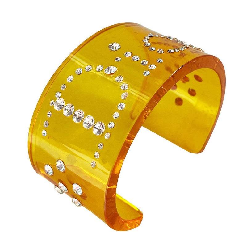 Christian Dior clear yellow lucite wide cuff bangle with Dior spelled out in white crystals.  