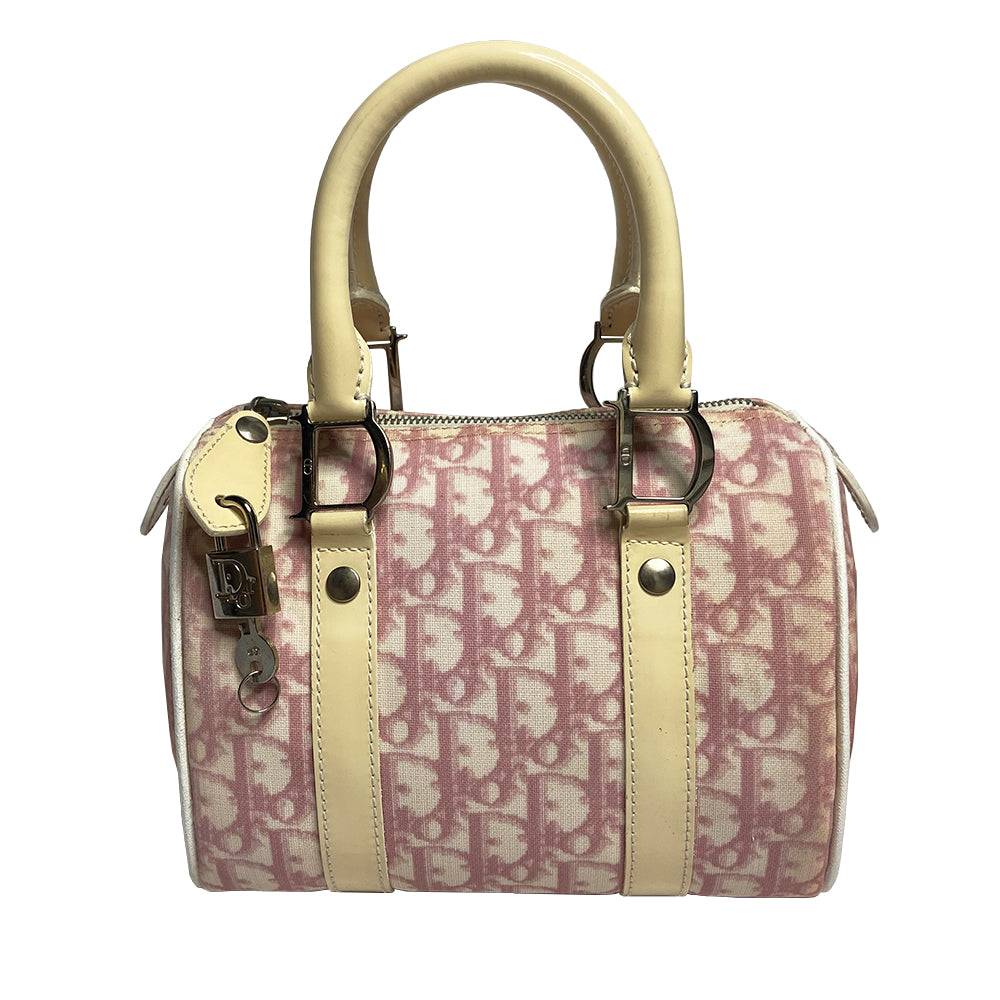 Christian Dior pink monogram mini boston by John Galliano for Dior, 2004 Pink monogram canvas with leather piping patent leather accent, rolled handles attached with silver-tone metal logo D. Pink textile interior with one zip pocket and one snap pocket, silver zipper and hardware. Included: Lock and key. Made in Italy 