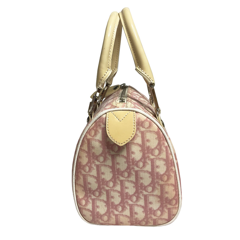 Christian Dior pink monogram mini boston by John Galliano for Dior, 2004 Pink monogram canvas with leather piping patent leather accent, rolled handles attached with silver-tone metal logo D. Pink textile interior with one zip pocket and one snap pocket, silver zipper and hardware. Included: Lock and key. Made in Italy 