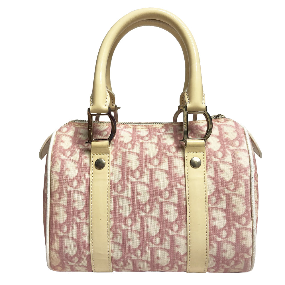 Christian Dior pink monogram mini boston by John Galliano for Dior, 2004 Pink monogram canvas with leather piping patent leather accent, rolled handles attached with silver-tone metal logo D. Pink textile interior with one zip pocket and one snap pocket, silver zipper and hardware. Included: Lock and key. Made in Italy 