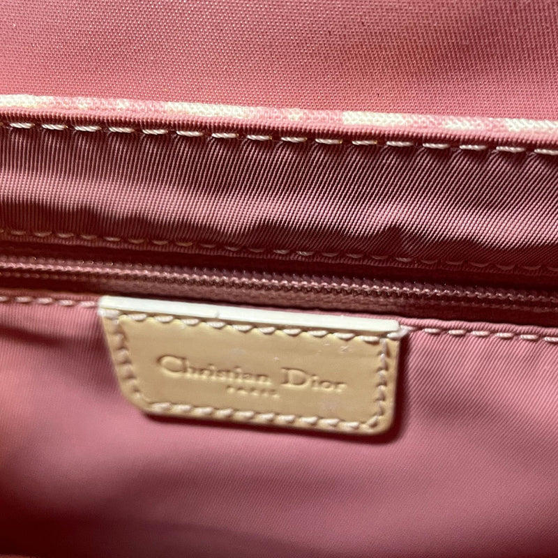 Christian Dior pink monogram canvas girly flap bag by John Galliano for Dior 2004 with pearl center white flowers, white patent piping, Swarovski crystal No 1 and Dior crystal logo. Pink with white edged satin canvas adjustable shoulder strap. Pink textile interior, one interior pocket. Made in Italy 