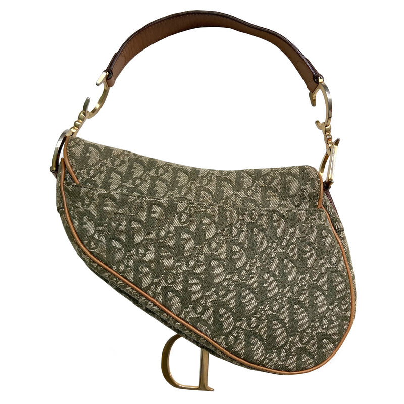 Christian Dior green diorissimo  monogram canvas saddle bag, John Galliano for Dior 2001 with gold-tone hardware, caramel leather. Single flat top leather handle featuring CD side logos. Velcro front closure at flap with front gold D logo. Rear slip snap pocket. Interior tonal nylon lining with single zip pocket. 