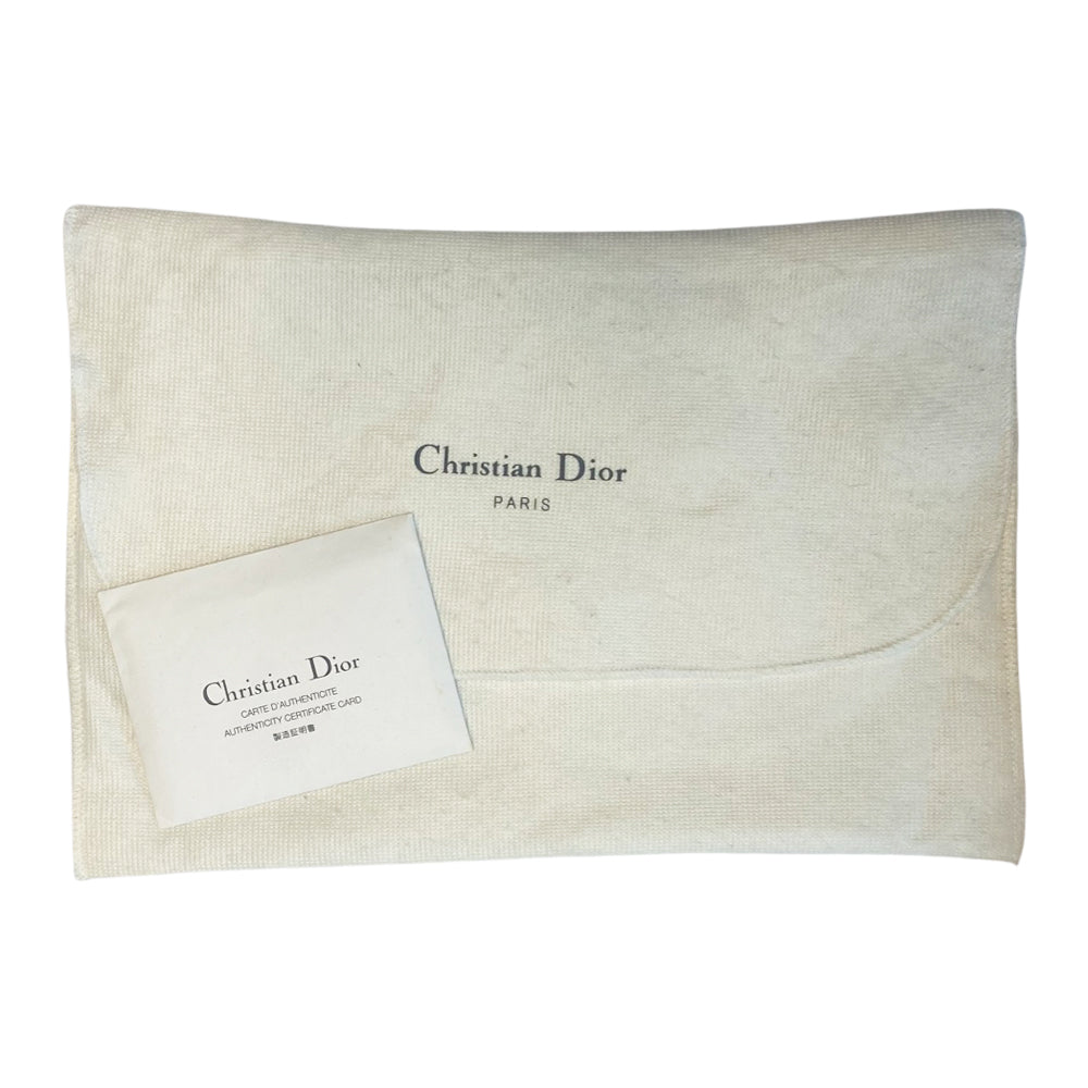 Christian Dior pink canvas monogram mini saddle pochette by John Galliano for Dior 2004 with white patent leather piping and strap, silver-tone hardware. Leather strap unclips at one end and can be looped to carry wristlet style. Top zipper closure with  pink textile interior. Duster and card included. Made in Spain 