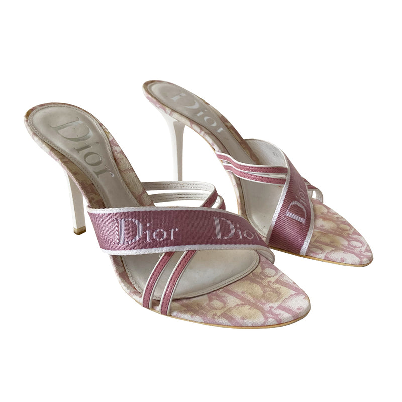 Christian Dior pink monogram slip on heels by John Galliano for Dior 2000’s. White glossy acrylic platform slip-on heels with criss cross solid pink Dior logo webbing ribbon crossed with pink and white leather upper. Pink monogram inner sole.  Made in Italy 