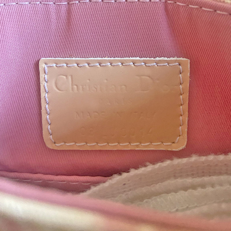 Christian Dior Girly pink monogram cross body reporter bag by John Galliano for Dior 2004 with pearl center white flowers, white piping, Swarovski crystal No 1 & Dior logo. Pink satin webbing adjustable shoulder strap with silver-tone Dior engraved sliders. Pink textile interior, one inner pocket. Made in Italy