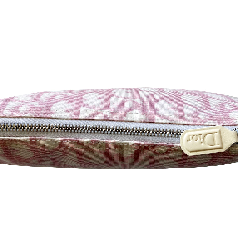 Christian Dior pink Diorissimo canvas saddle Bag John Galliano for Dior 2004.  Diorissimo canvas saddle pochette with white leather piping and strap, silver-tone hardware. Leather strap unclips at one end that loops to carry wristlet style. Zip closure with Dior embossed leather zipper pull, pink textile interior. Made in Spain 