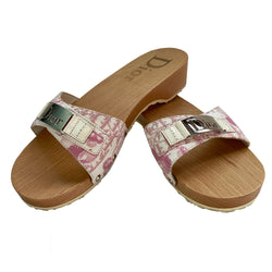 Christian Dior Girly Diorissimo floral slides Sandals, 2004 by John Galliano for Christian Dior. Pink and creme Diorissimo printed canvas upper features silver-tone cutout Dior logo plate,  ivory patent and silver-tone side studs. Dior logo stamped into wood sole with white rubber bottom DIOR logo stamped lower soles. 