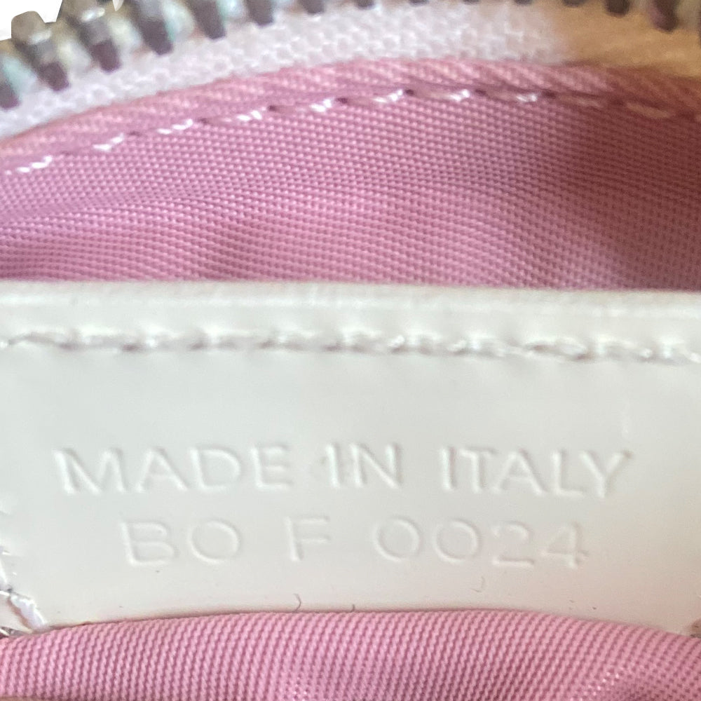 Christian Dior Girly pink monogram cross body reporter bag by John Galliano for Dior 2004 with pearl center white flowers, white piping, Swarovski crystal No 1 & Dior logo. Pink satin webbing adjustable shoulder strap with silver-tone Dior engraved sliders. Pink textile interior, one inner pocket. Made in Italy