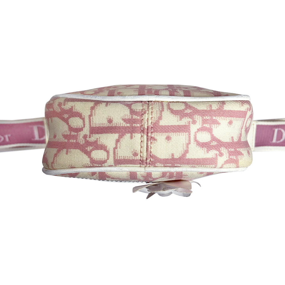 Christian Dior Girly pink monogram cross body reporter bag by John Galliano for Dior 2004 with pearl center white flowers, white piping, Swarovski crystal No 1 & Dior logo. Pink satin webbing adjustable shoulder strap with silver-tone Dior engraved sliders. Pink textile interior, one inner pocket. Made in Italy