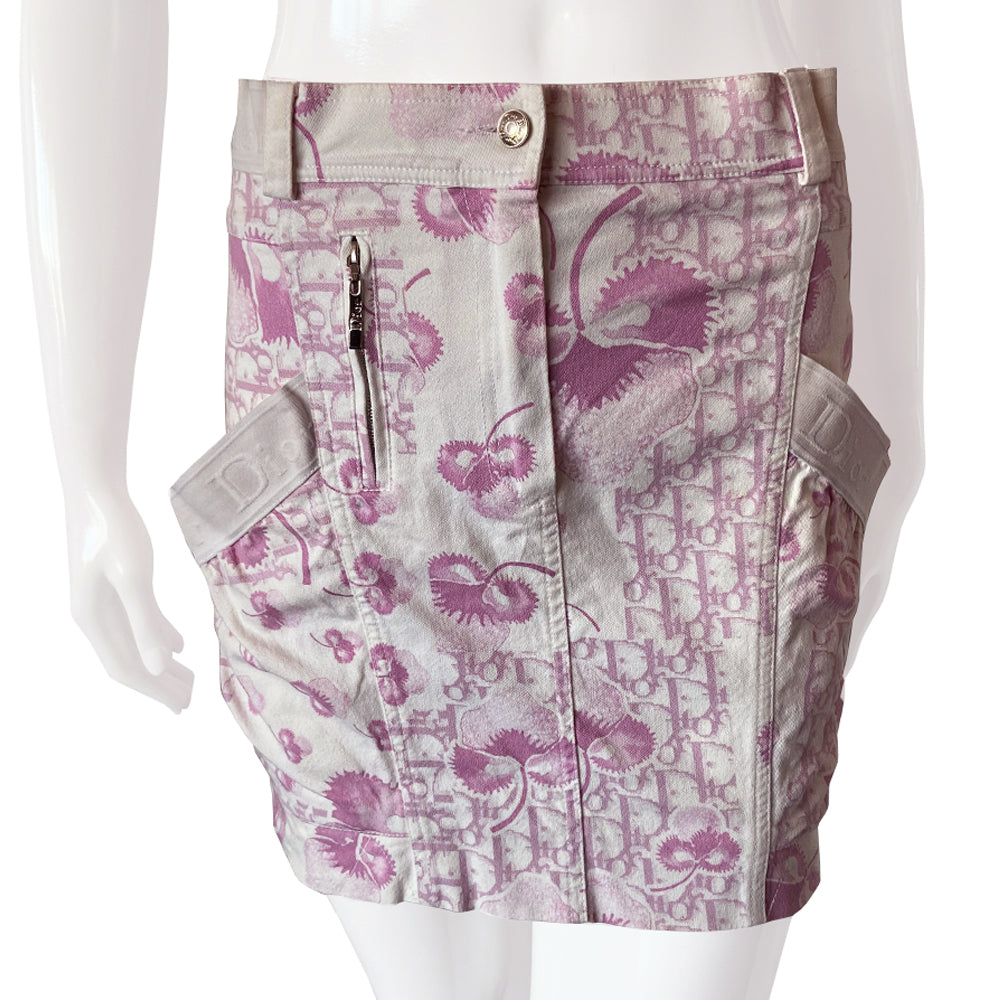 Christian Dior pink cherry blossom skirt by John Galliano for Dior circa 2004 from Logo Flowers Collection. Panelled skirt with belt loops, Dior logo elastic details. Front zipper closure with silver-tone logo button closure and embellished with front logo silver-tone zipper detail, 2 large side wrap around patch pockets. 