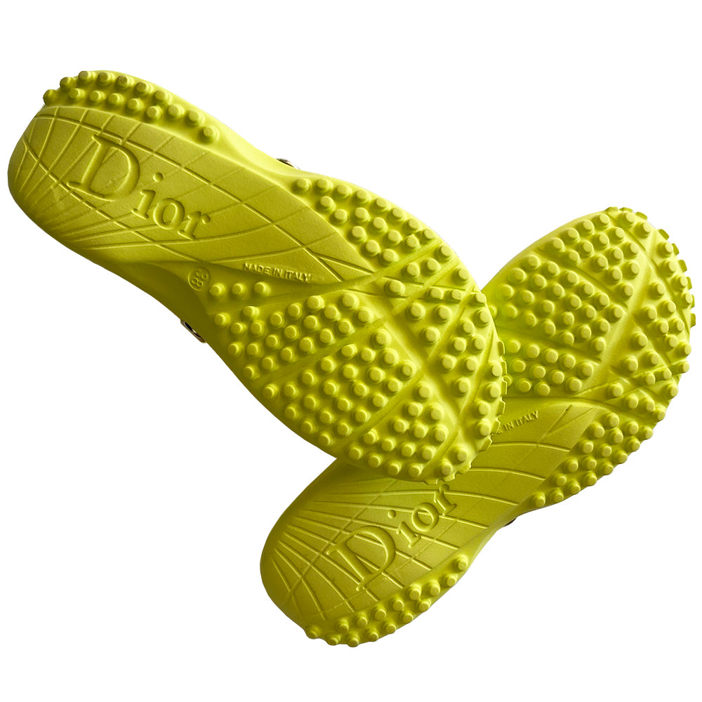 Christian Dior lime green and yellow monogram jelly pool slides, John Galliano era. Clear yellow upper with embossed Dior logo, perforated air holes, silver-tone Dior logo stud attachments at sides, monogram insole with clear nubby overlay for extra comfort. Rubber sole with grippy nubs and Dior logo imprint. Made in Italy 