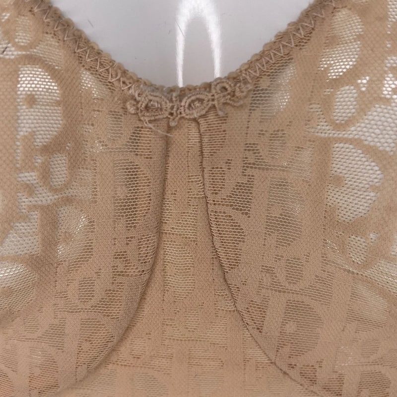 Neutral tone Christian Dior Monogram slip-on stretch bodysuit circa 1990s with low back, adjustable elastic straps, underwire at bust, hooks at crotch. Made in USA 