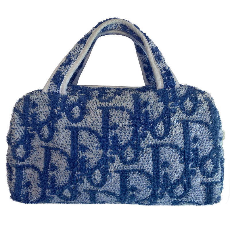 Christian Dior navy monogram terry towel mini boston bag circa 2005 with No. 2 white appliqué in front, white piping on handles and at zipper. Waterproof vinyl interior with 2 slip pockets, zipper closure with white textile ribbon zipper pull.