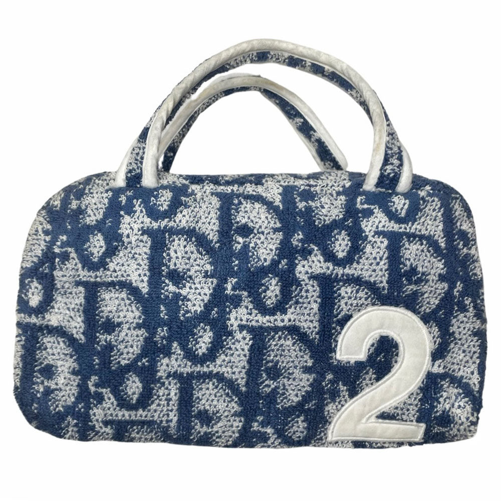 Christian Dior navy monogram mini terry fabric boston bag circa 2005 with No. 2 white appliqué in front, white piping on handles and at zipper, waterproof vinyl interior with 2 slip pockets, zipper closure, white textile ribbon zipper pull. 