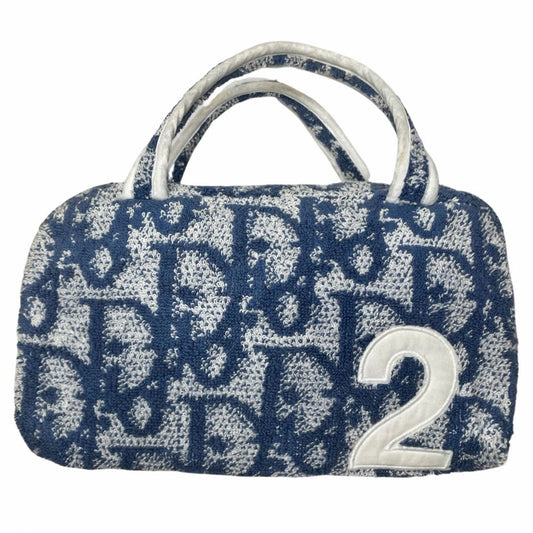 Christian Dior navy monogram mini terry fabric boston bag circa 2005 with No. 2 white appliqué in front, white piping on handles and at zipper, waterproof vinyl interior with 2 slip pockets, zipper closure, white textile ribbon zipper pull. 
