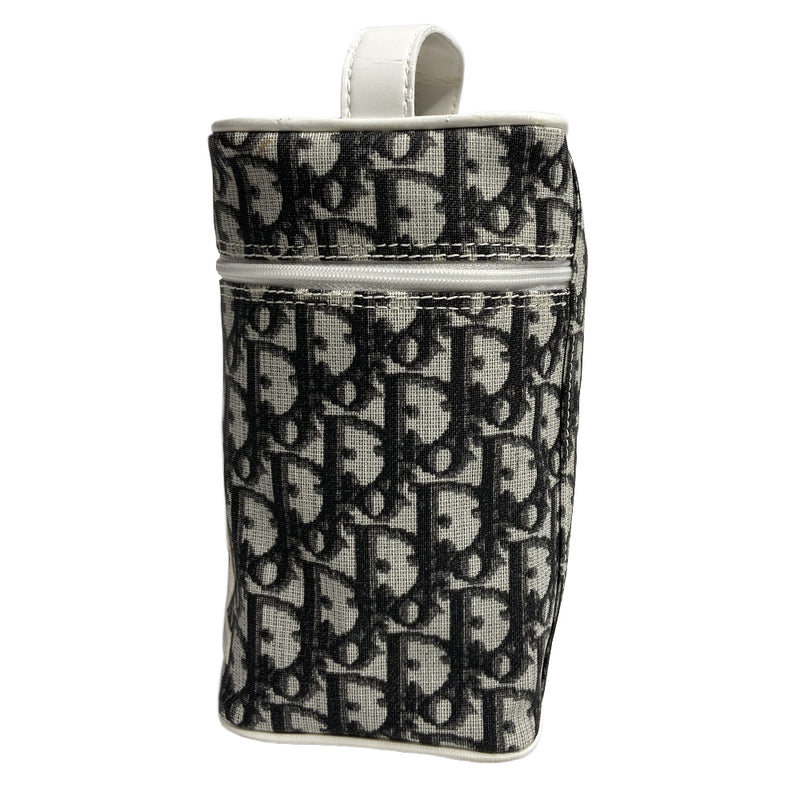 Christian Dior monogram mini vanity case by John Galliano for Dior, 2006. Black and grey monogram canvas rectangular cylinder with white patent piping, No 2 appliqué and top handle. Wrap around silver-tone top zipper closure, black textile interior. Made in Spain 