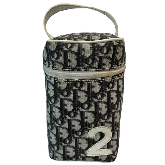 Christian Dior canvas black and grey monogram top handle mini rectangular cylinder bag by John Galliano for Dior, 2003 with white patent piping, top handle and leather No 2 appliqué. Wrap around silver-tone top zipper closure opens to black textile interior. Made in Spain 