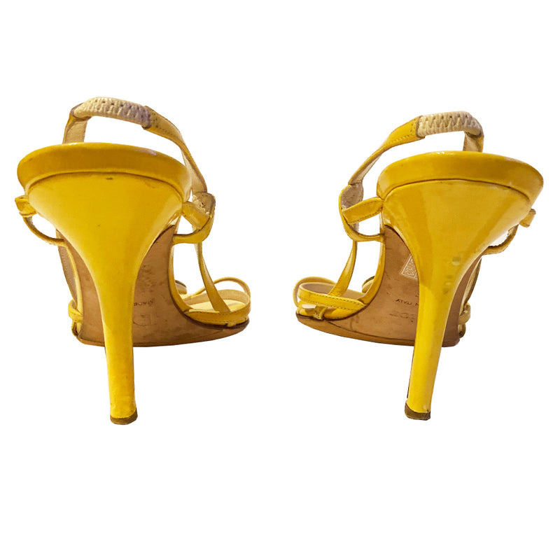 Christian Dior Medallion pastel yellow patent leather logo strappy heels sandals with slip-on style elastic heel and open toe. Silver metal logo medallion on cream  enamel backing in front. Heels and other sections have been professionally reconditioned. Made in Italy 